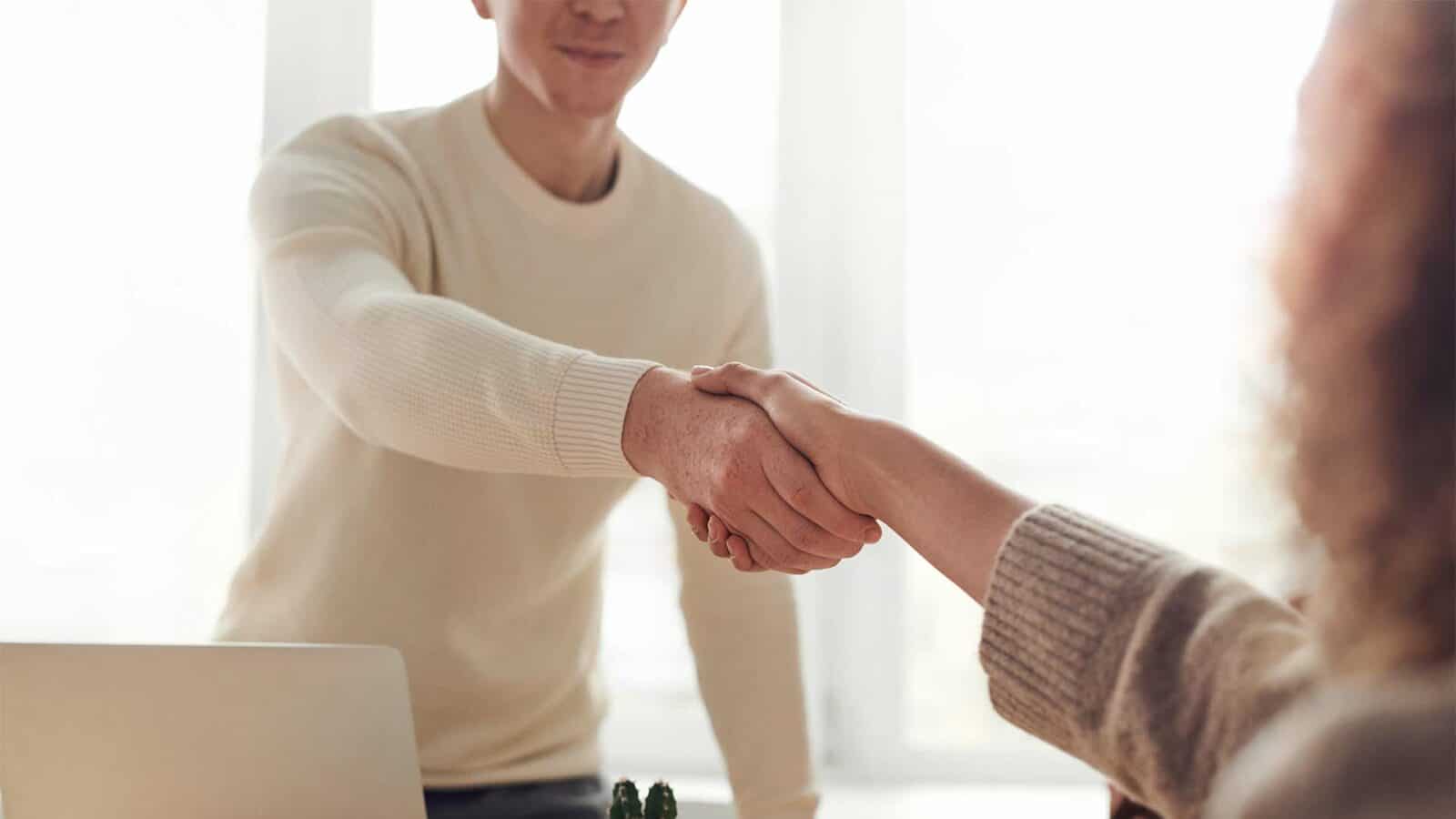 shaking hands in a meeting for Disaster recovery planning