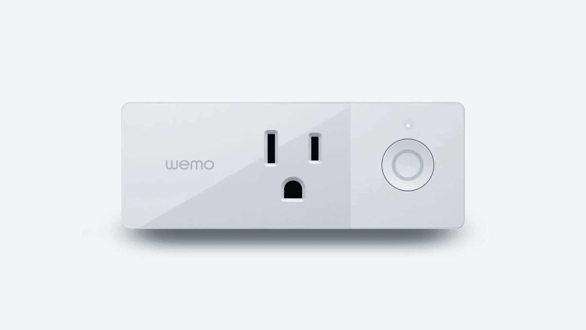 A variety of electronics are connected to power plugs and sockets, with a Wemo jack in the center.