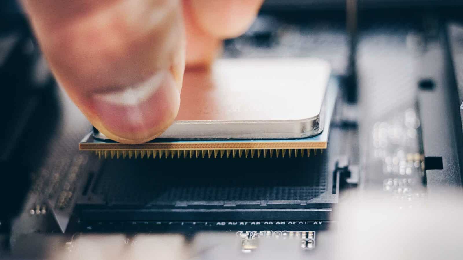 A person is working on electronics in an indoor setting, utilizing their knowledge of electronic engineering.