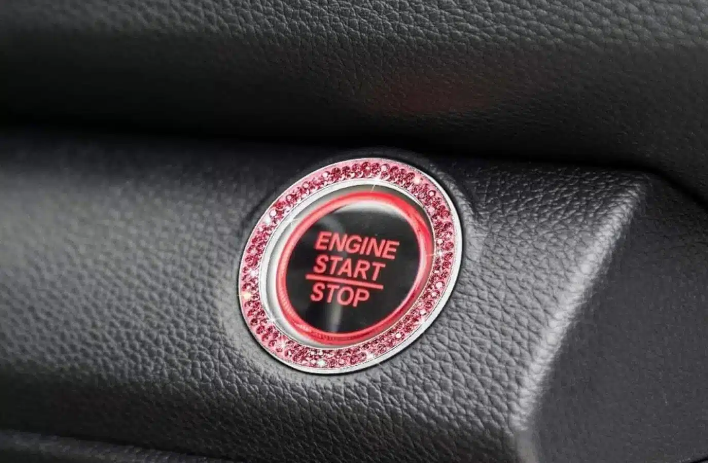 A car logo with a text "ENGINE START STOP" and an emblem is prominently displayed.