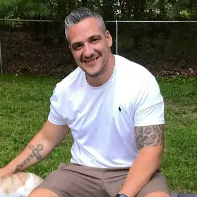 A person sits on the grass.