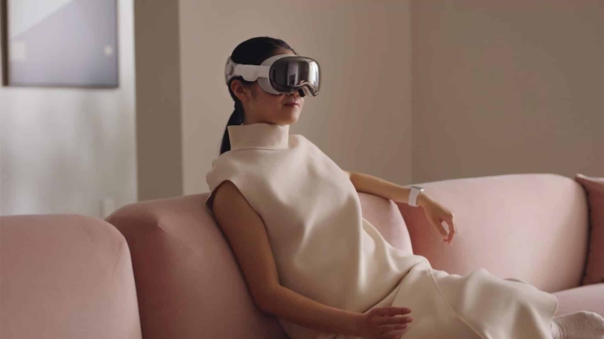 A person wearing a Apple Vision Pro in a living room setting.