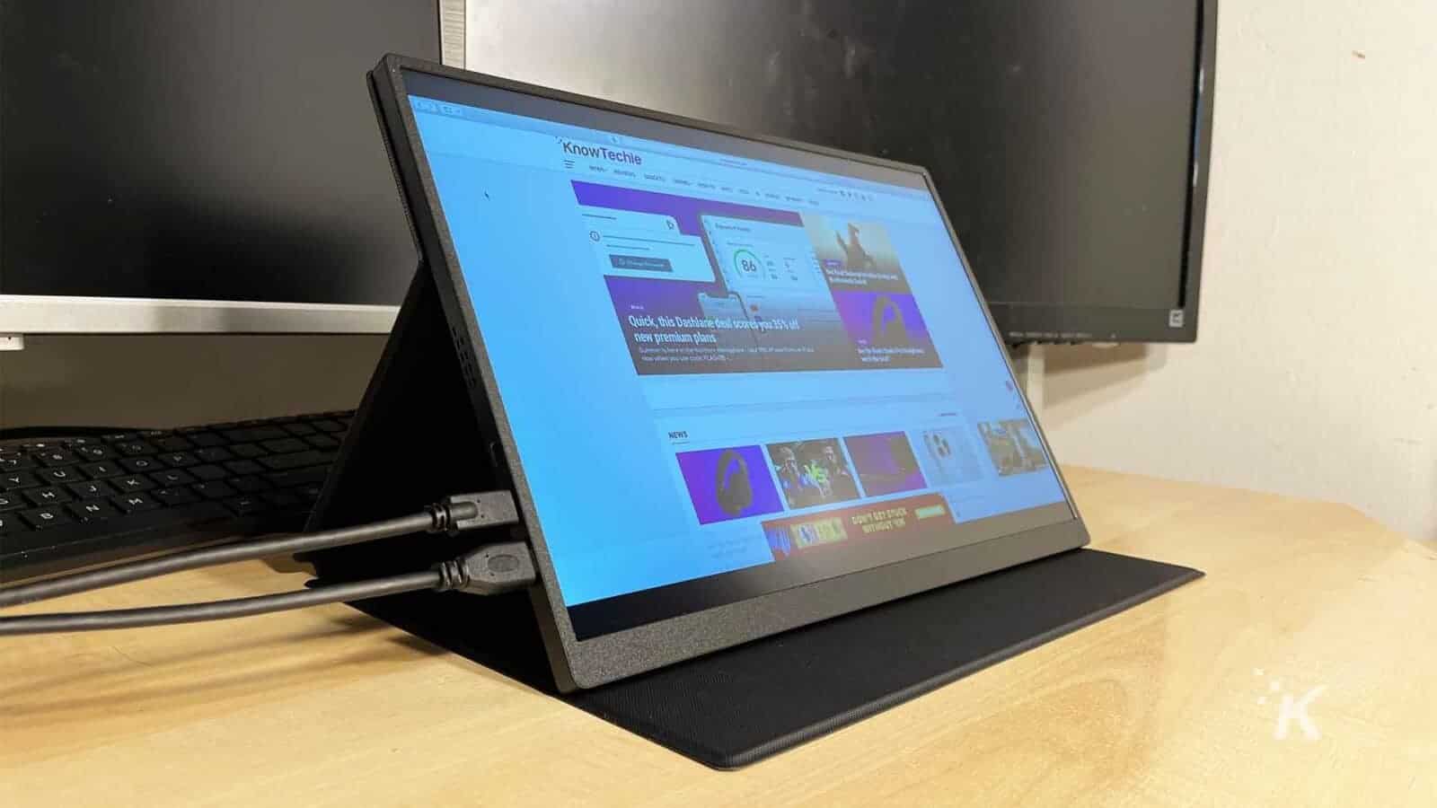 UPERFECT-portable-monitor on a desk with the KnowTechie website on screen