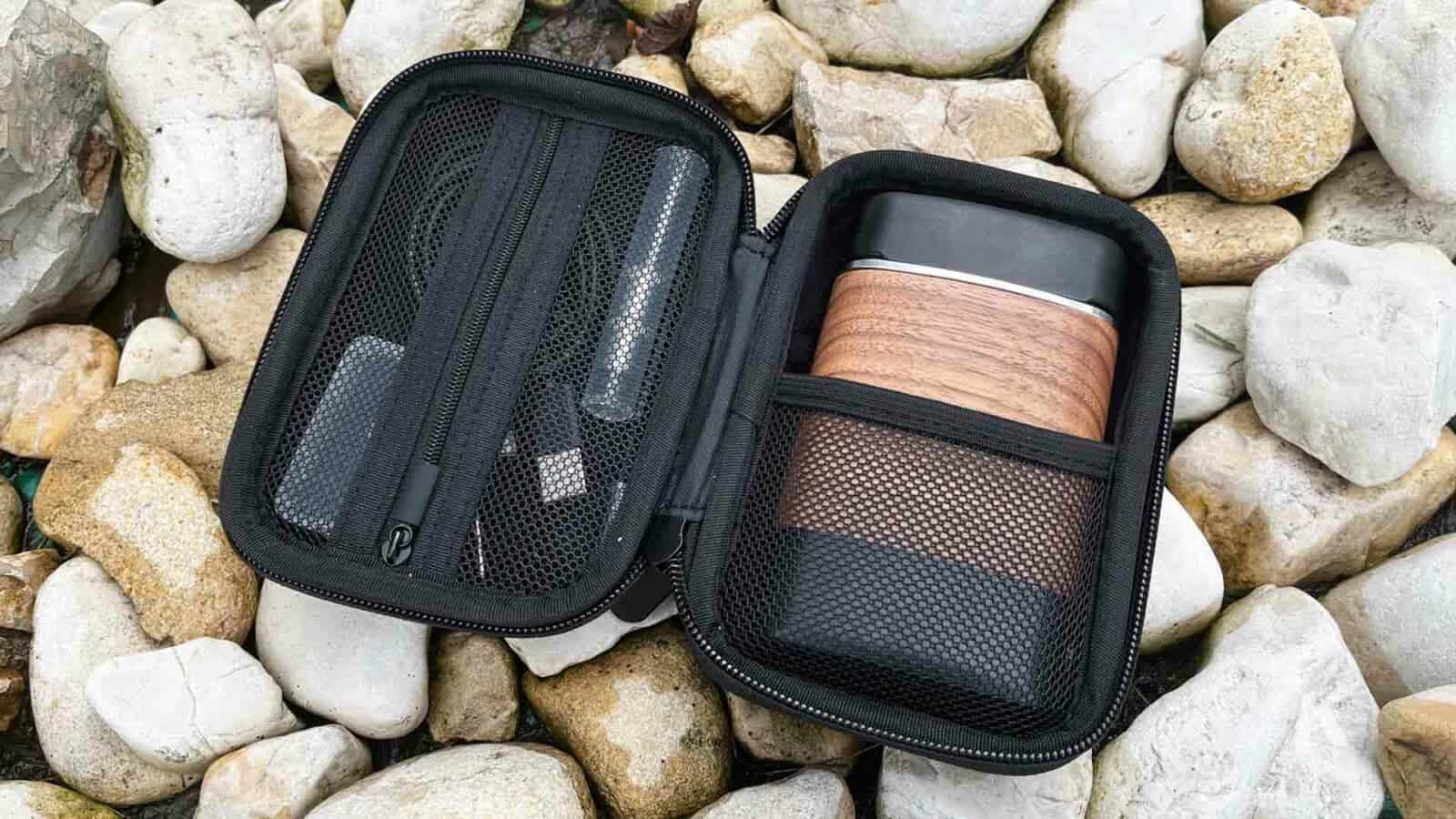 Angus portable Vaporizer by YLLVAPE outdoors by rocks