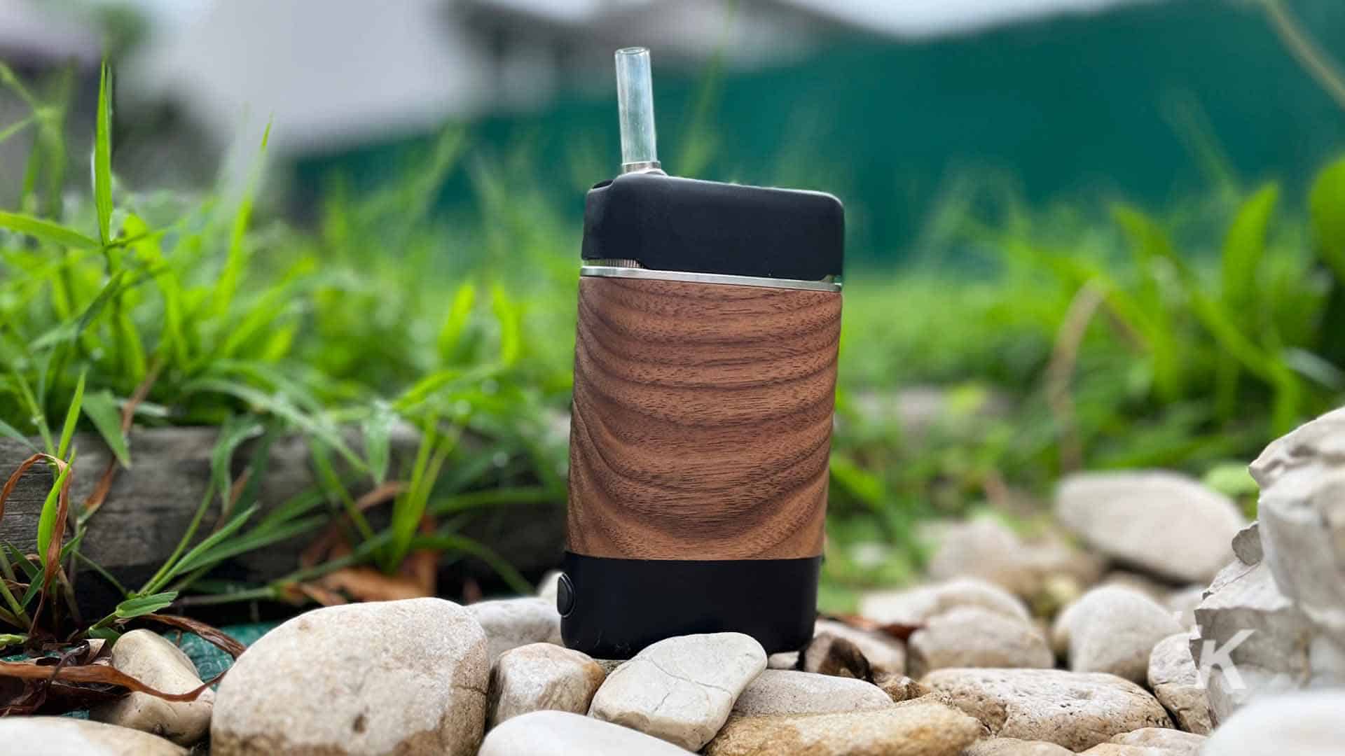 Angus portable vaporizer by YLLVAPE outdoors by rocks