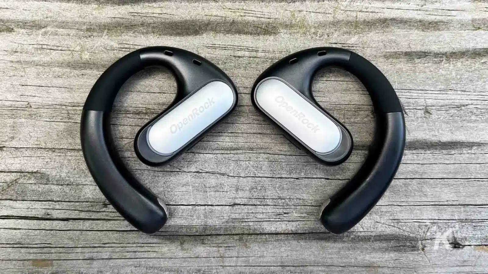 OpenRock Pro earbuds on table