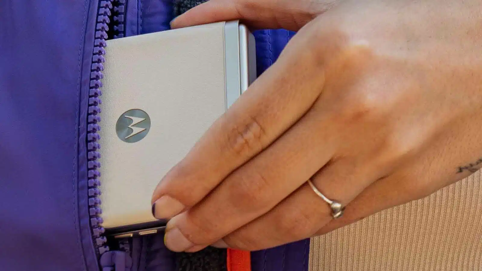 A person holds a cell phone.