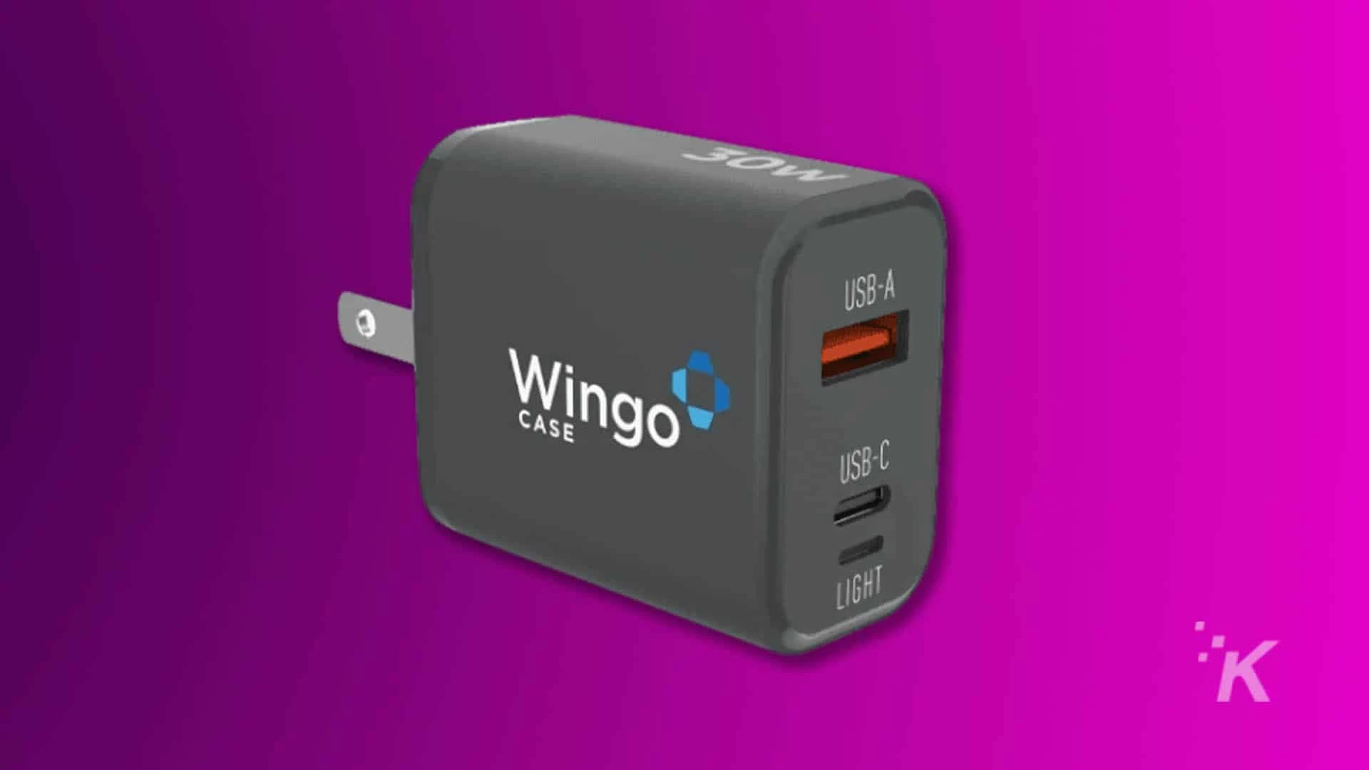 A Wingo USB-A CASE USB-C LIGHT is illuminating an electronic device surrounded by gadgets.