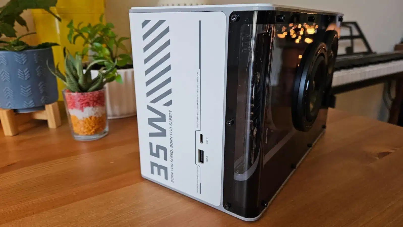 The left side of the Edifier QD35 on a wooden table.