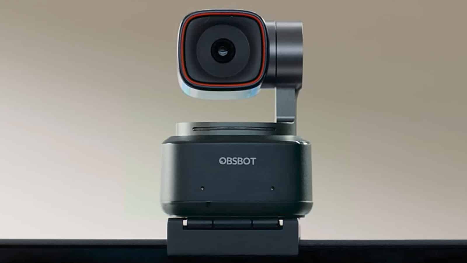This image shows an OBSBOT Tiny 2 webcam brand AI-powered camera with a swivel head mounted on a gray base, designed for tracking and recording movement.