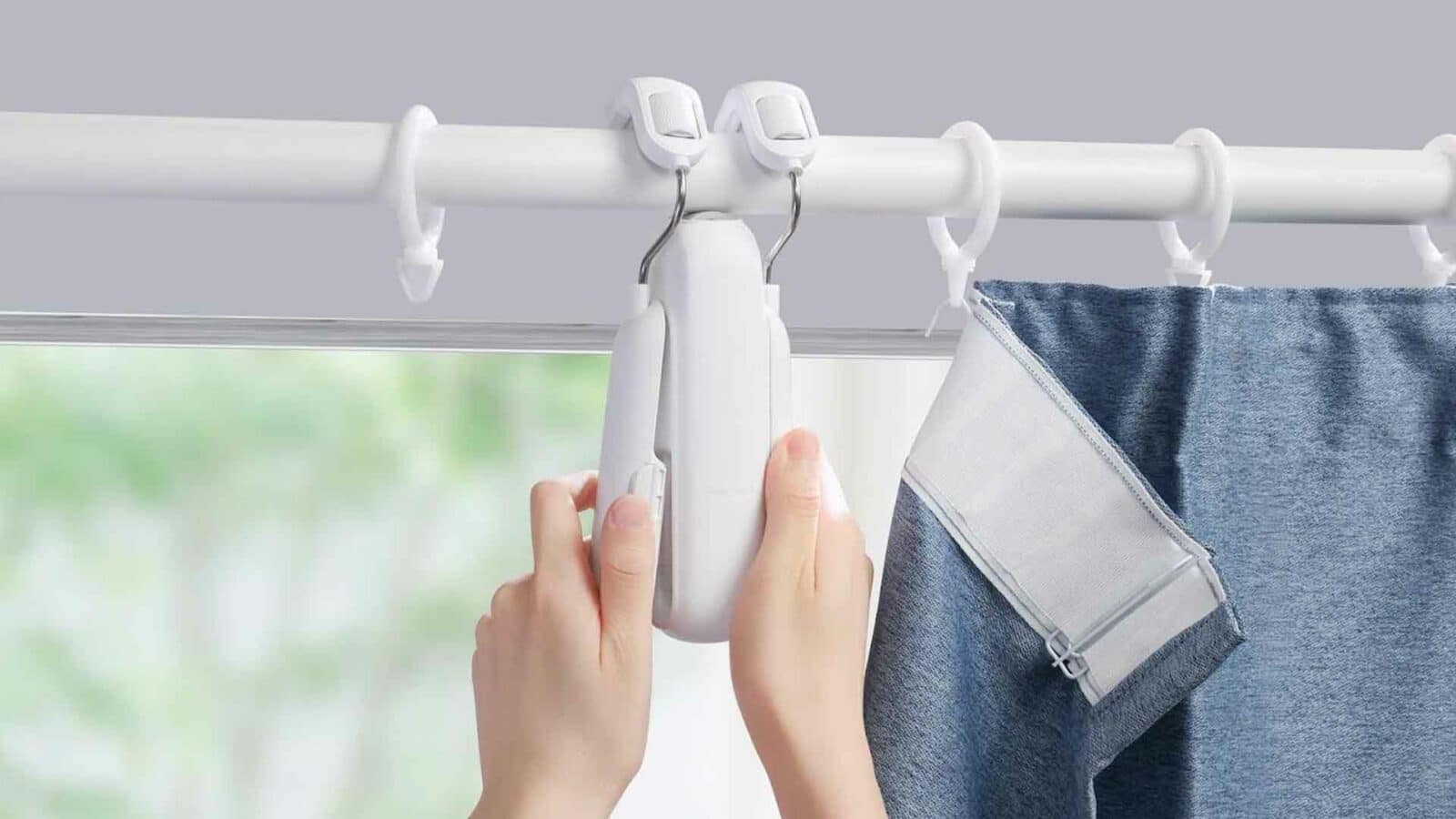 Person holding the switchbot curtain 3