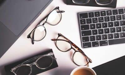 Ocushield anti blue light glasses on table with keyboard