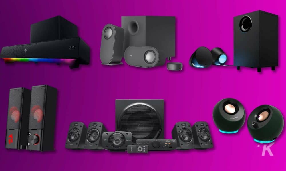 Assorted home audio speaker systems on purple background.