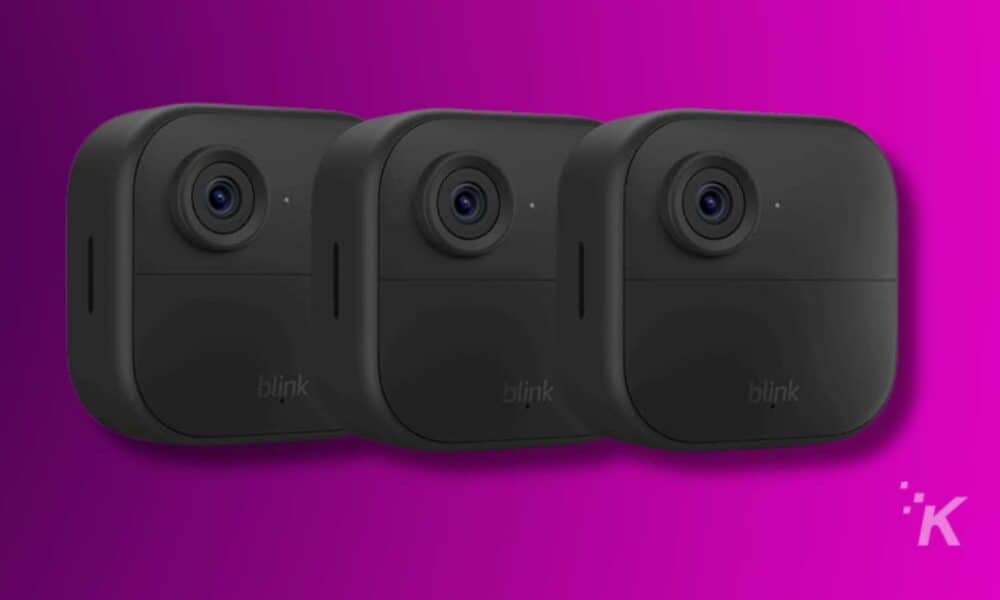 Three Blink cameras on pink background