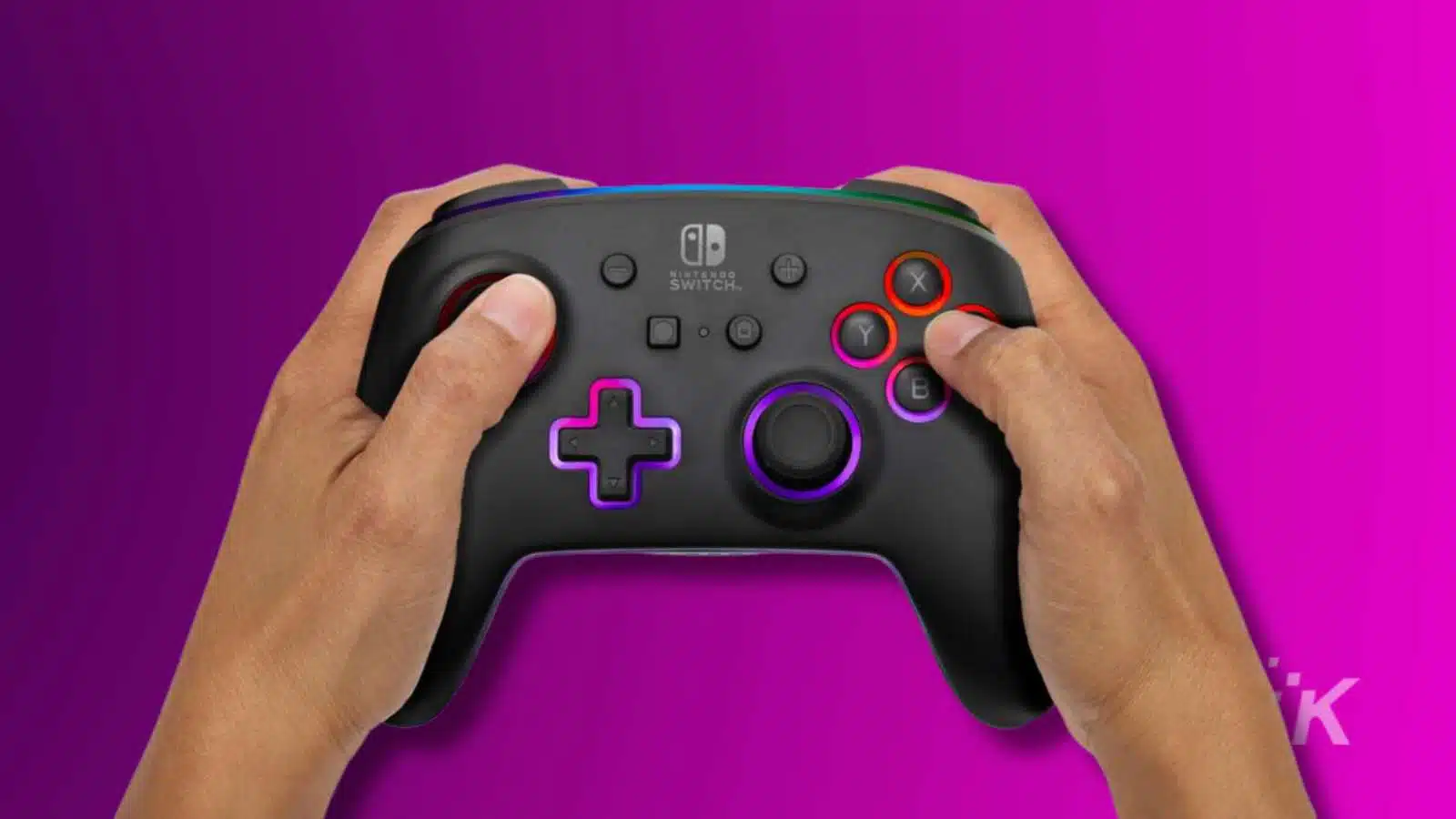 Two hands holding a Nintendo Switch Pro Controller against a purple background.