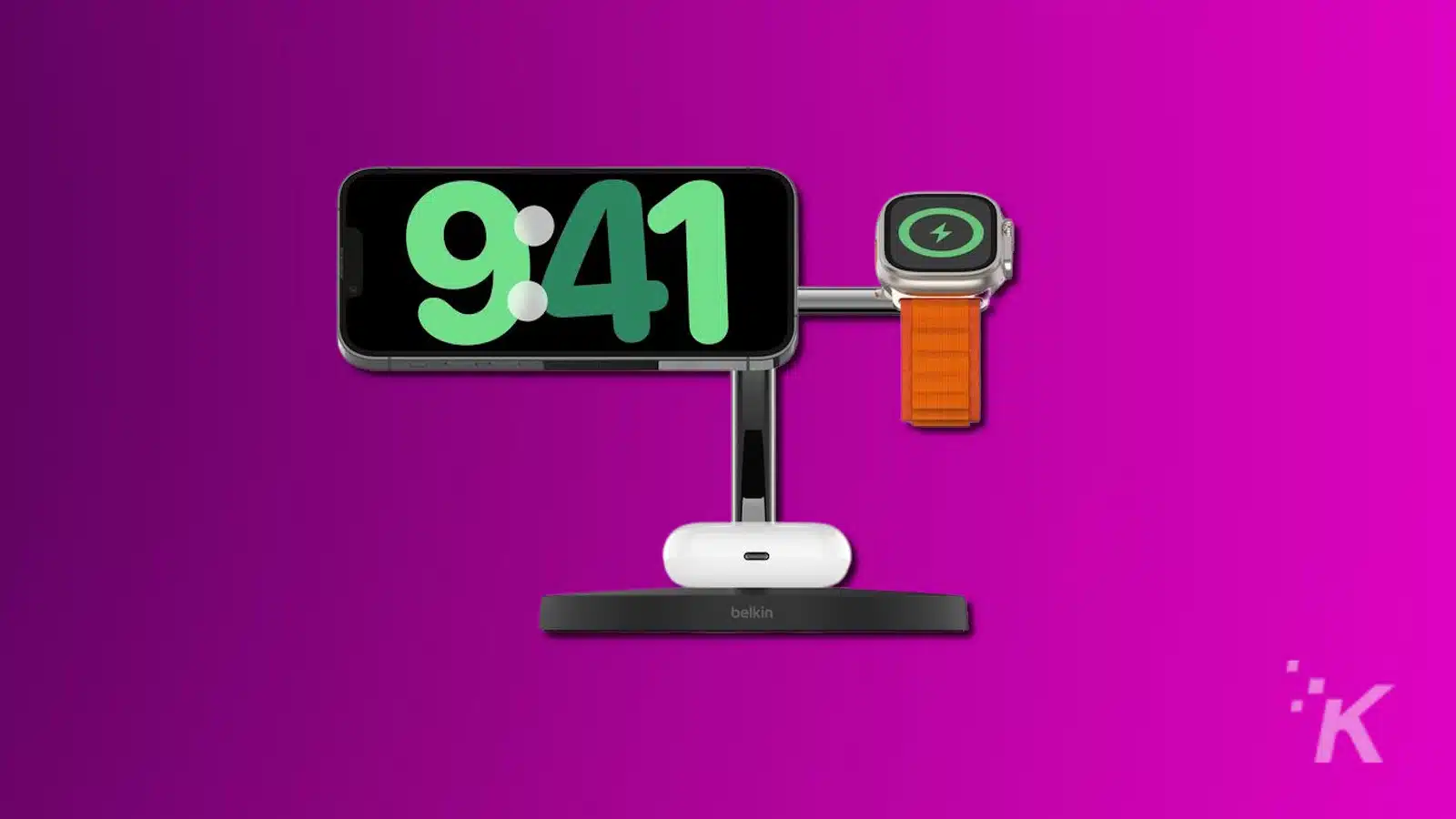 Smartphone and smartwatch charging on modern dock.