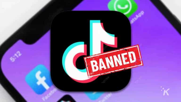 TikTok app icon with 'BANNED' stamp on smartphone screen.