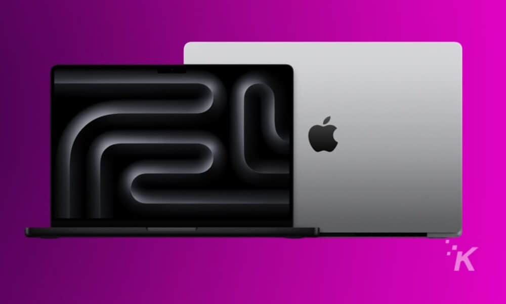 Apple laptops on magenta background