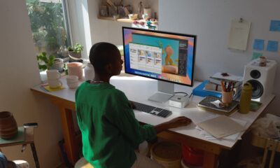 Person working at desk with computer