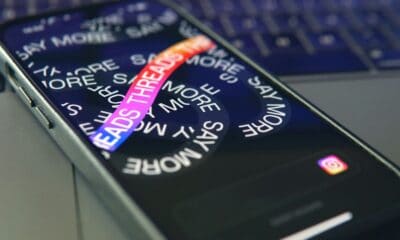 Smartphone with Threads app on screen, close-up view.