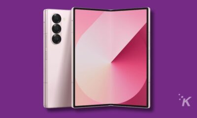 Foldable smartphone with triple camera, purple background