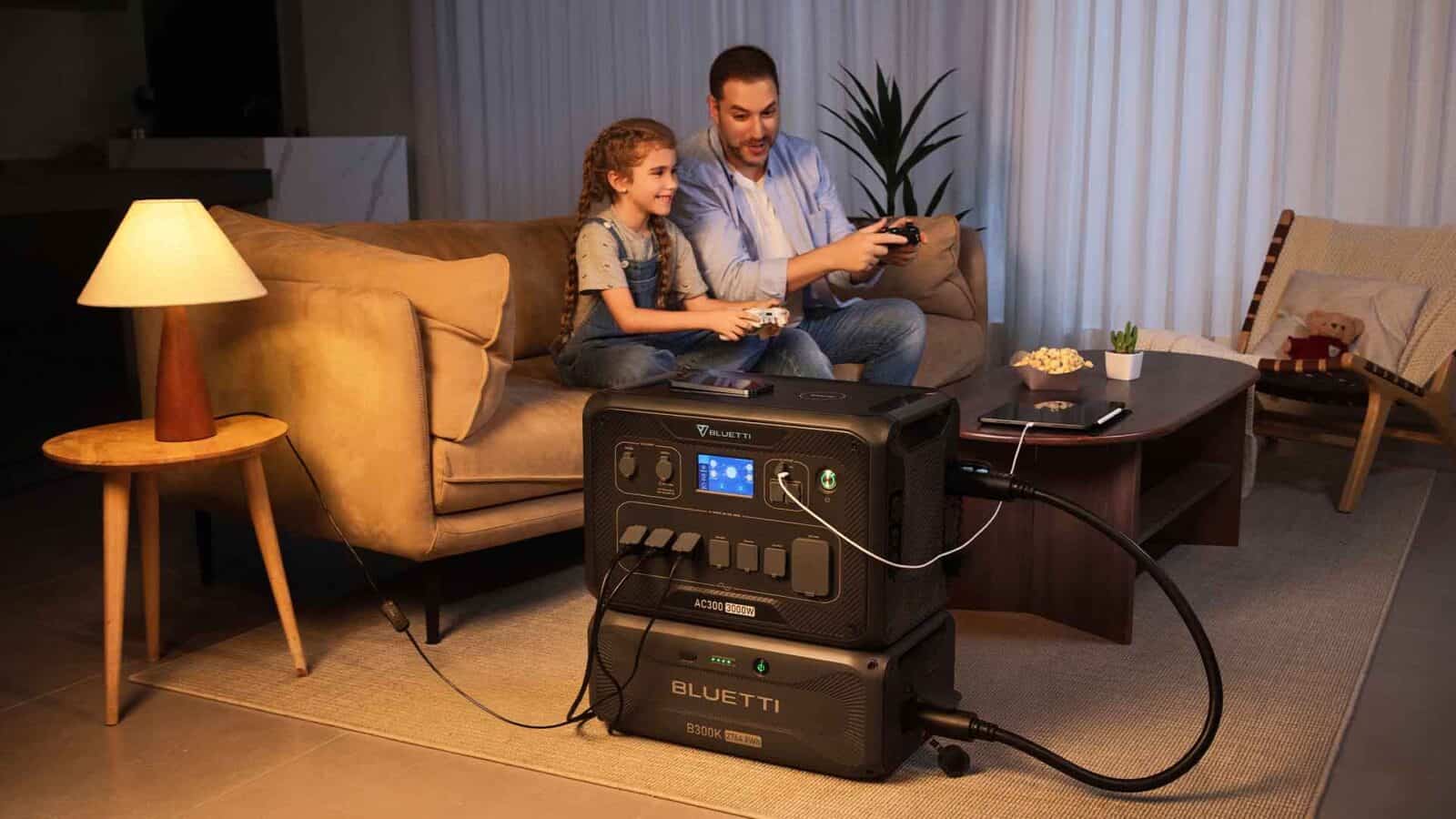 Family gaming with portable power station indoors.