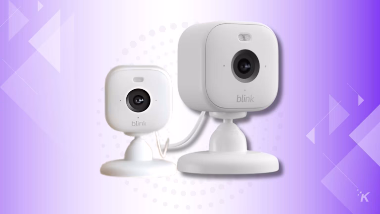 Two Blink security cameras on purple background.