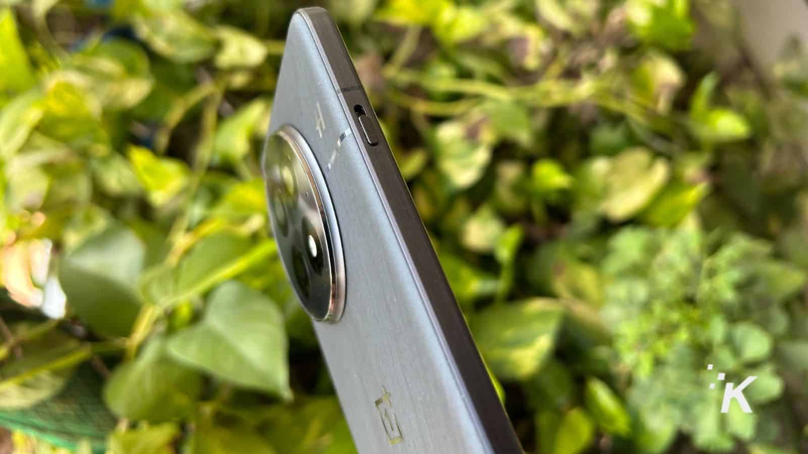 Smartphone side view with focus on camera lens.