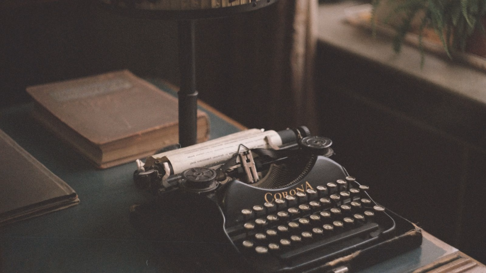 Vintage typewriter on a wooden desk.