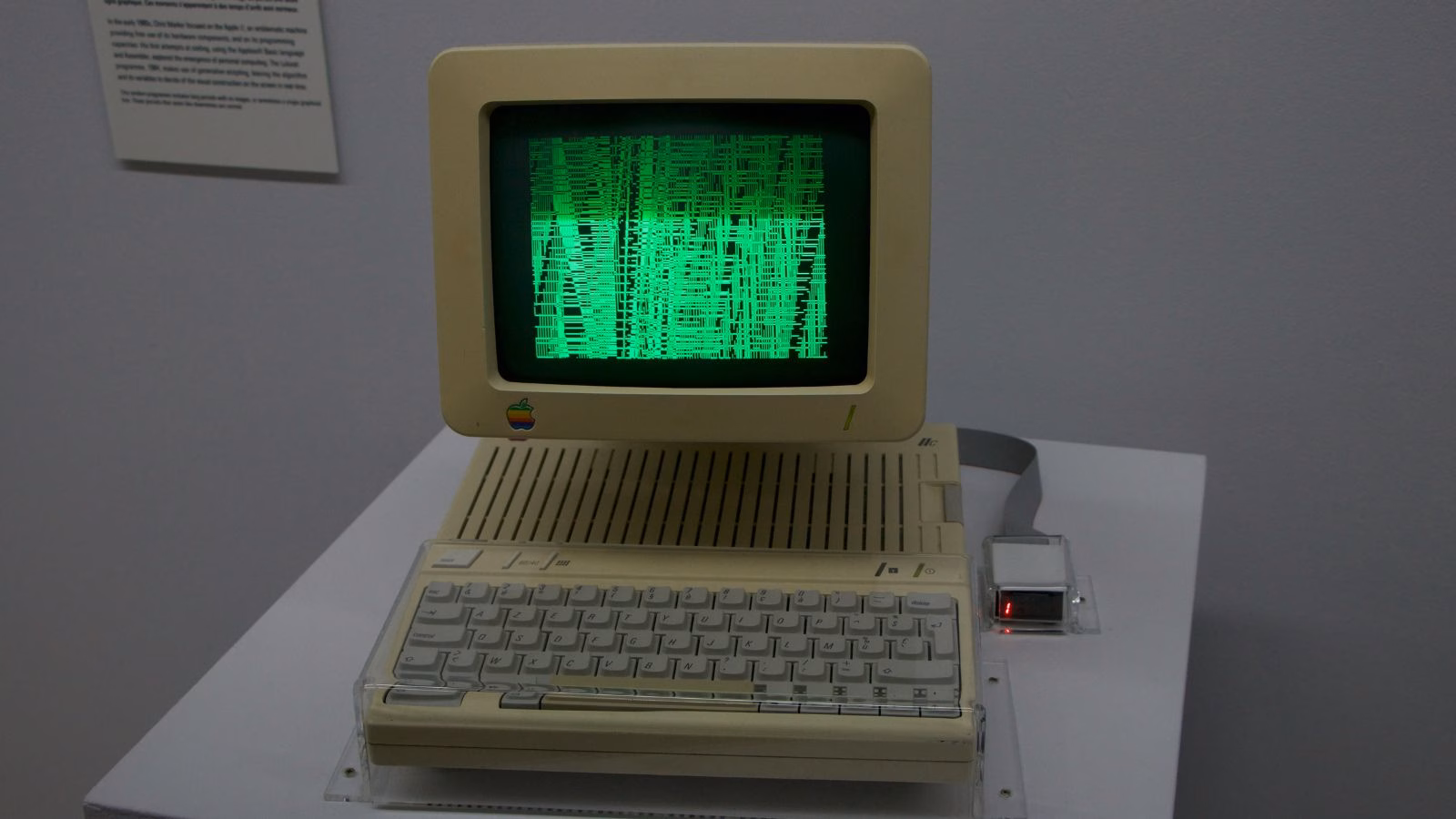 Vintage Apple computer with green screen display.