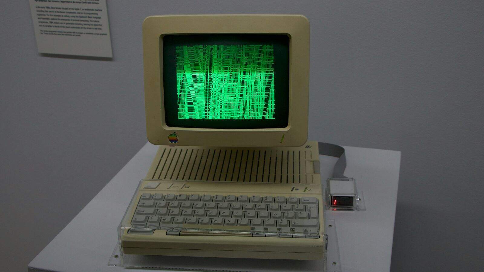 Vintage Apple computer with green screen display.