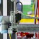 Robotic arm handling box in automated process