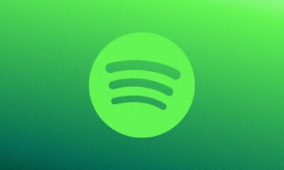 Green Spotify logo on a gradient background.
