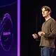 Speaker presenting on AI and Stablecoins technology