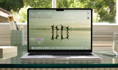 Laptop displaying nature wallpaper on a desk.