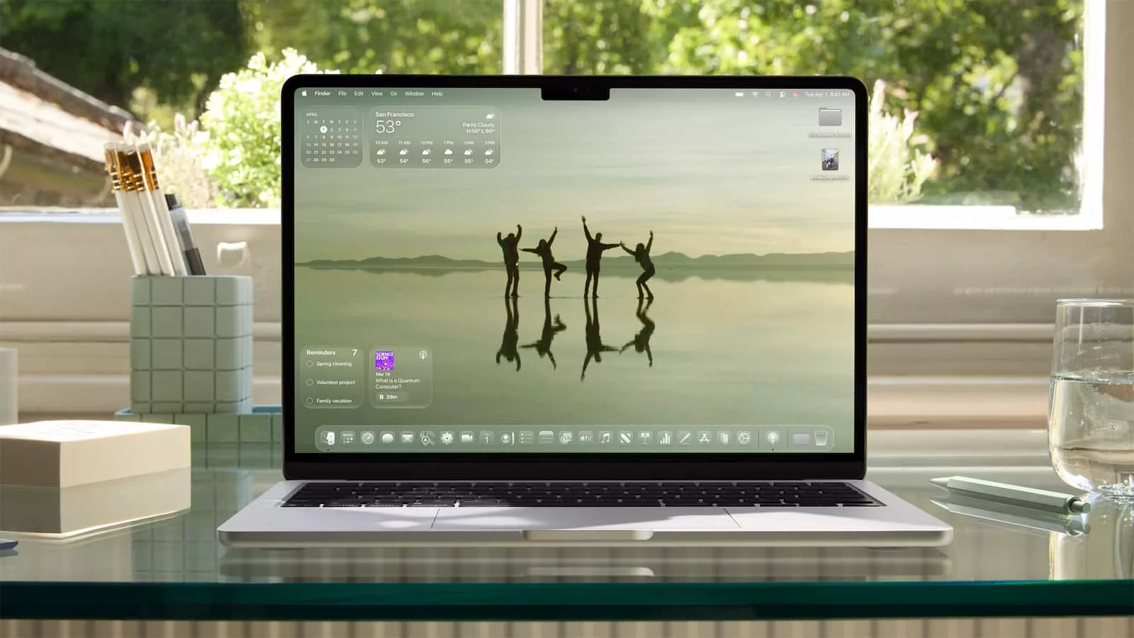 Laptop displaying nature wallpaper on a desk.