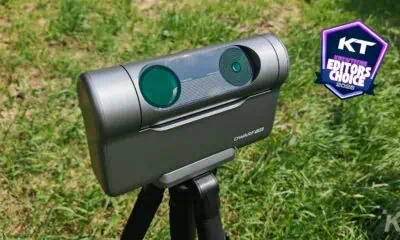 Portable telescope with award badge on grass