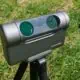 Portable telescope with award badge on grass