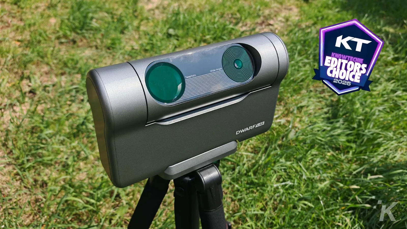 Portable telescope with award badge on grass