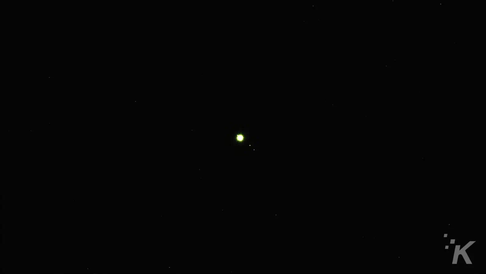 Bright planet and moons in night sky