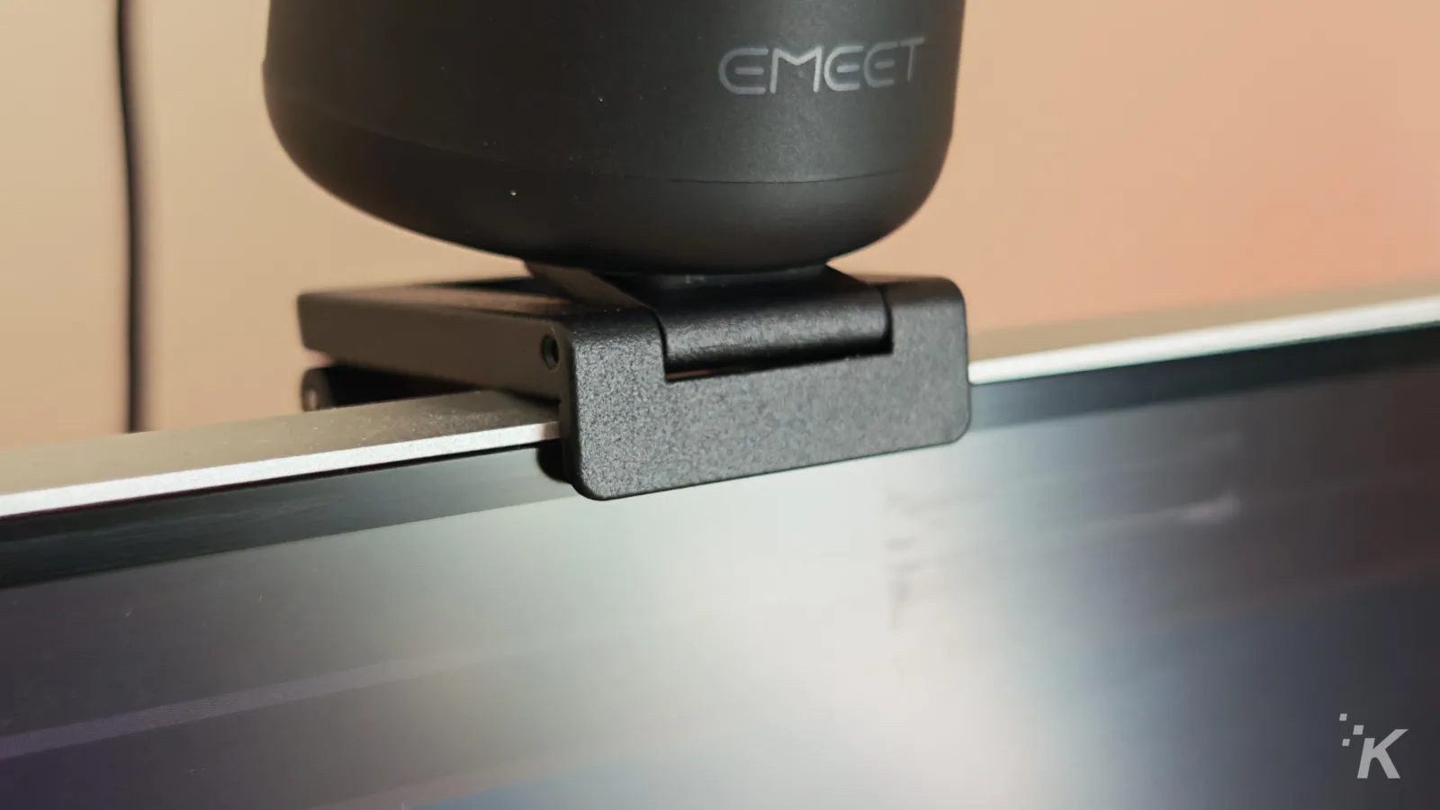 Black webcam mounted on monitor