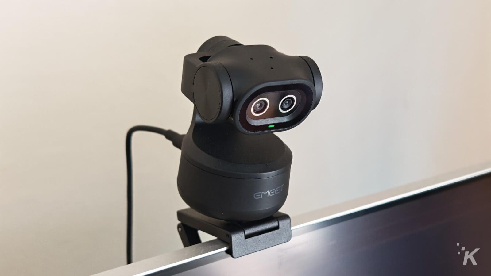 Black webcam mounted on a monitor