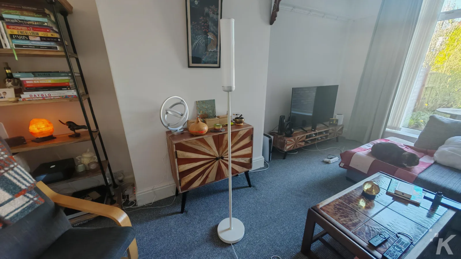 Cozy living room with lamp and bookshelf