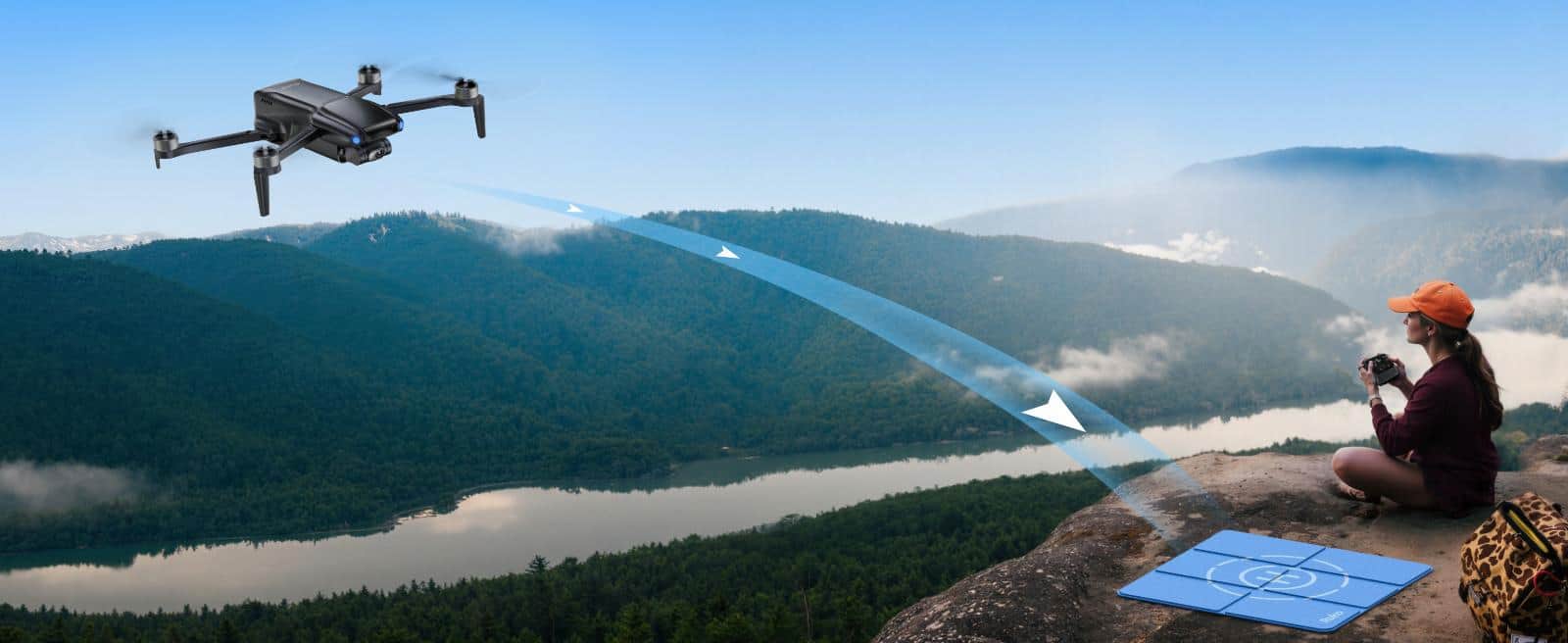Person operating drone overlooking scenic mountains
