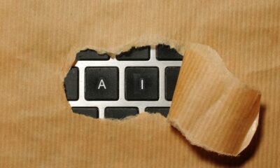 Torn paper reveals AI keyboard keys