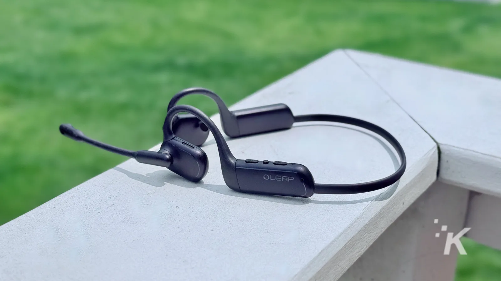 Wireless bone conduction headphones on table outdoors