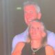 Man and woman smiling at event