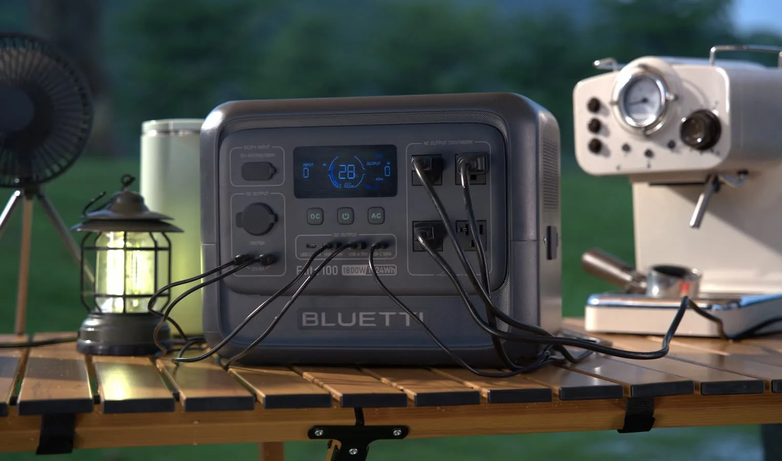 BLUETTI power station on outdoor table with devices