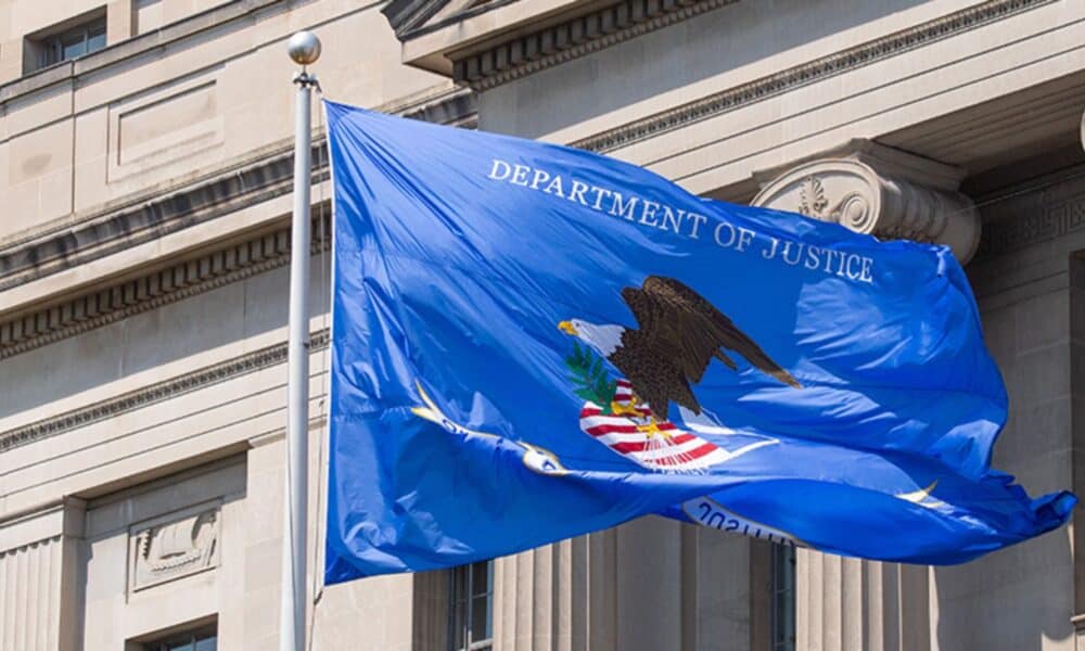 Department of Justice flag flying outdoors