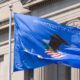 Department of Justice flag flying outdoors